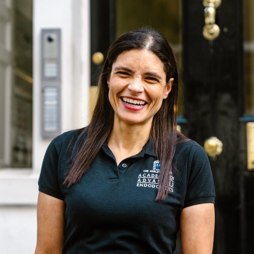 Speciality Dentist in Oral Surgery, Leigh-Ann Elias, standing outside of the dental practice in London