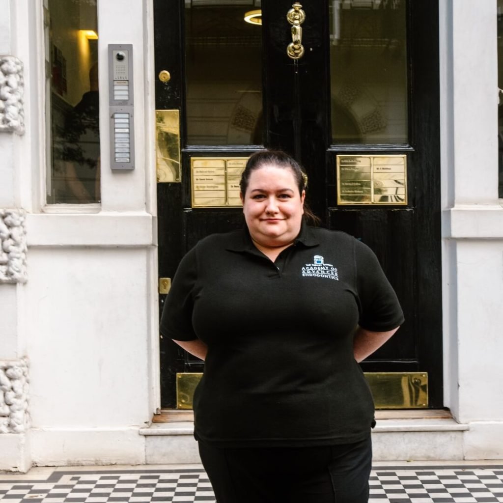 Assistant Manager, Compliance Lead and Specialist Endodontic Nurse,Rachel Whittaker-Percival, standing outside of the dental practice in London