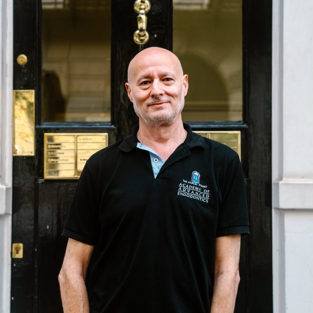 Clinical director, Richard Kahan, standing outside of the dental practice in London